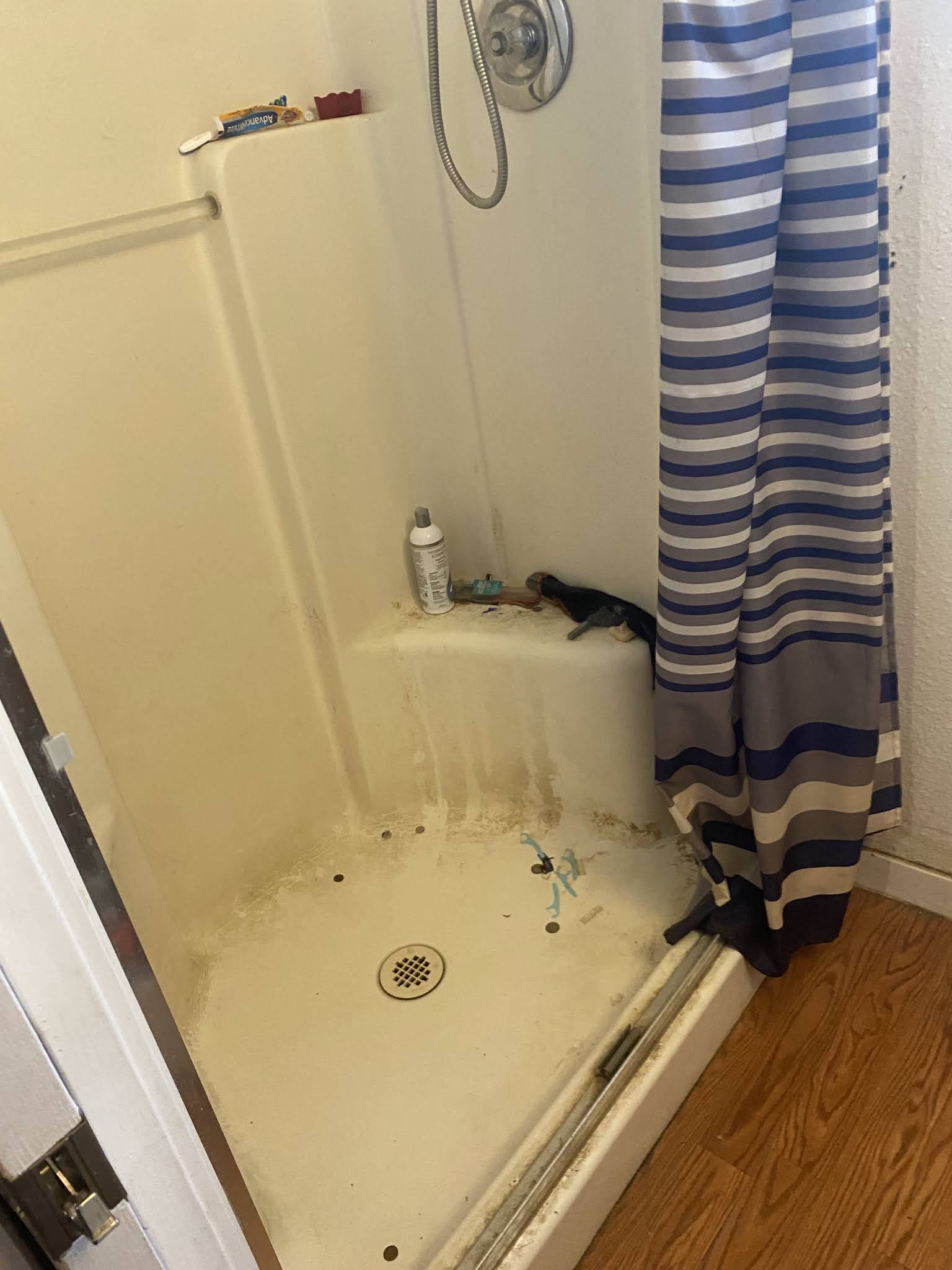 Before cleaning view of a shower area